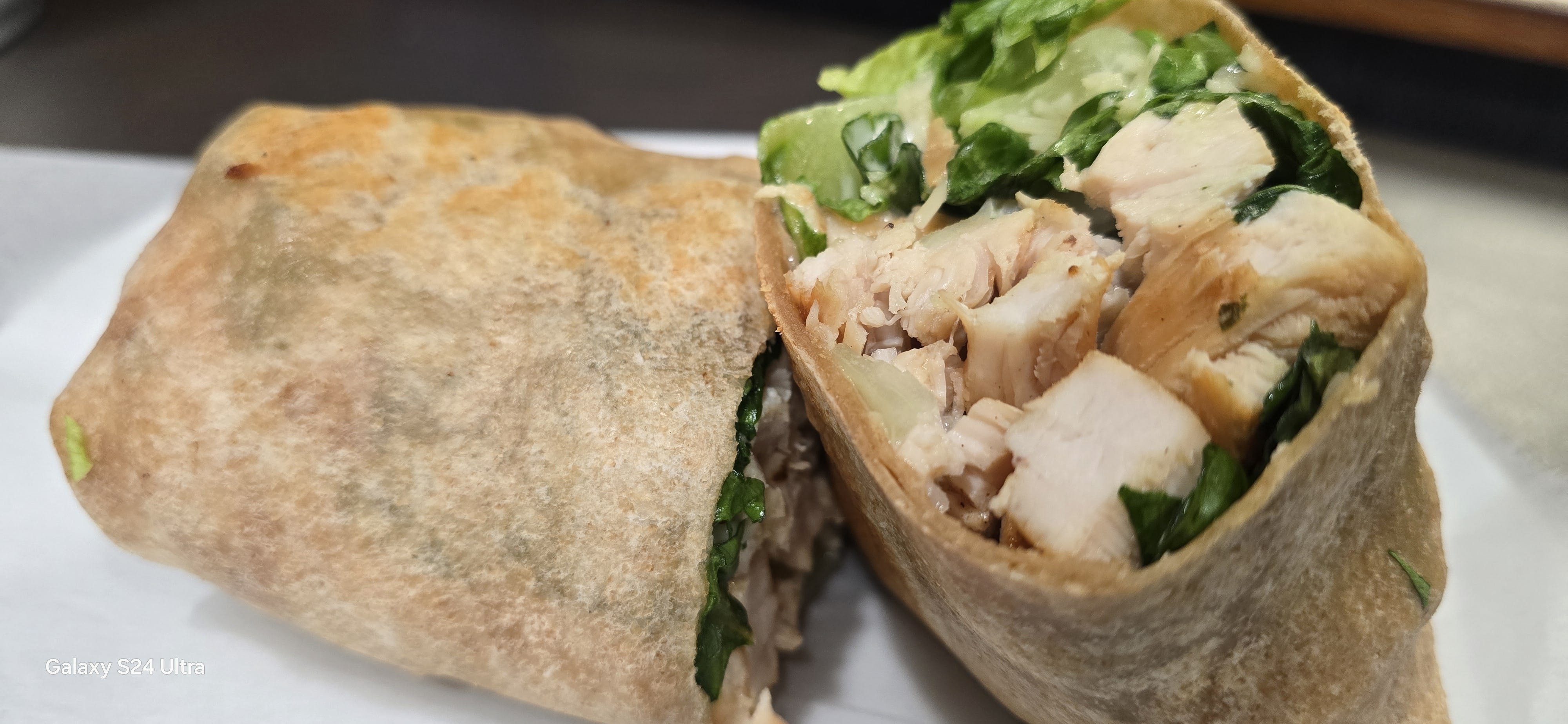 Grilled Chicken Caesar Wrap Served with Fries.